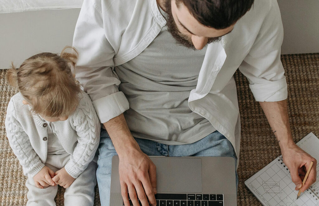 Father and child spending quality time together after implementing business systems
