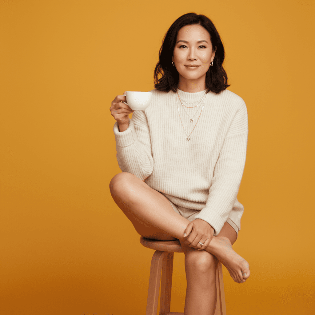 Business owner sitting on mustard stool professional lifestyle